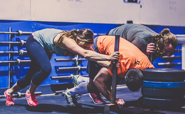 Woman and Men Doing CrossFit