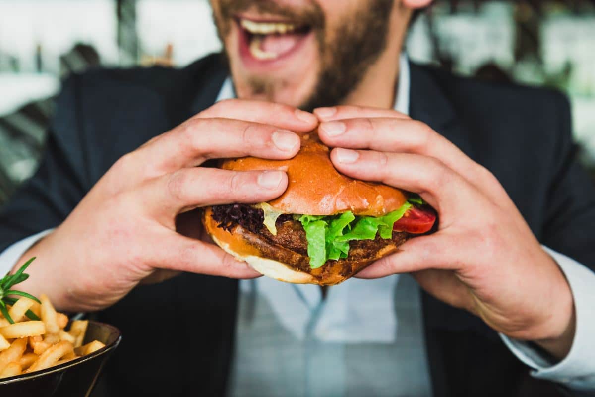 Man Eating a Hamburger: The Food Looks Good 'AF'