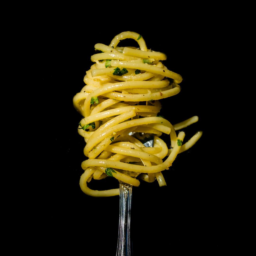 butter noodles on a fork