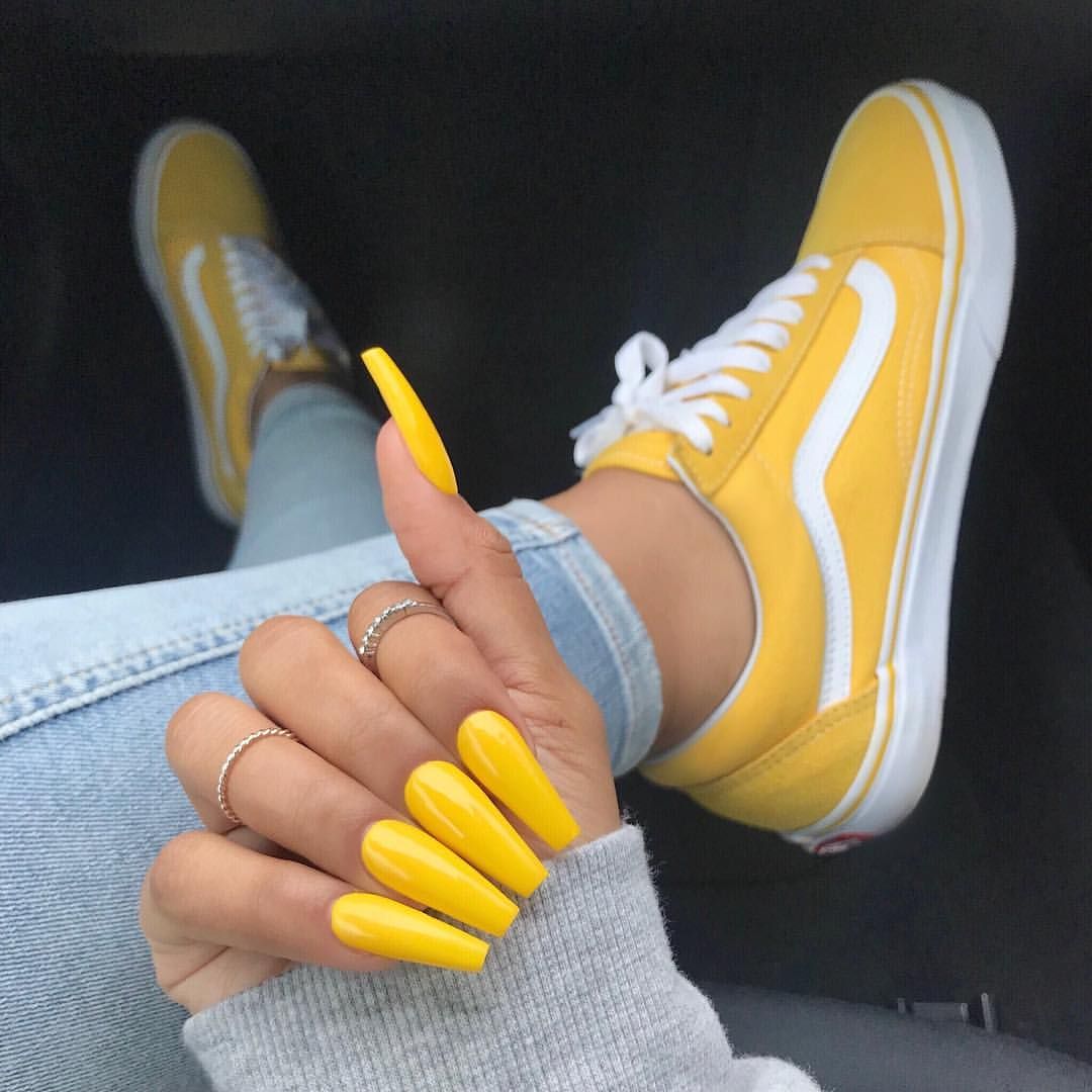 vans old skool yellow on feet 