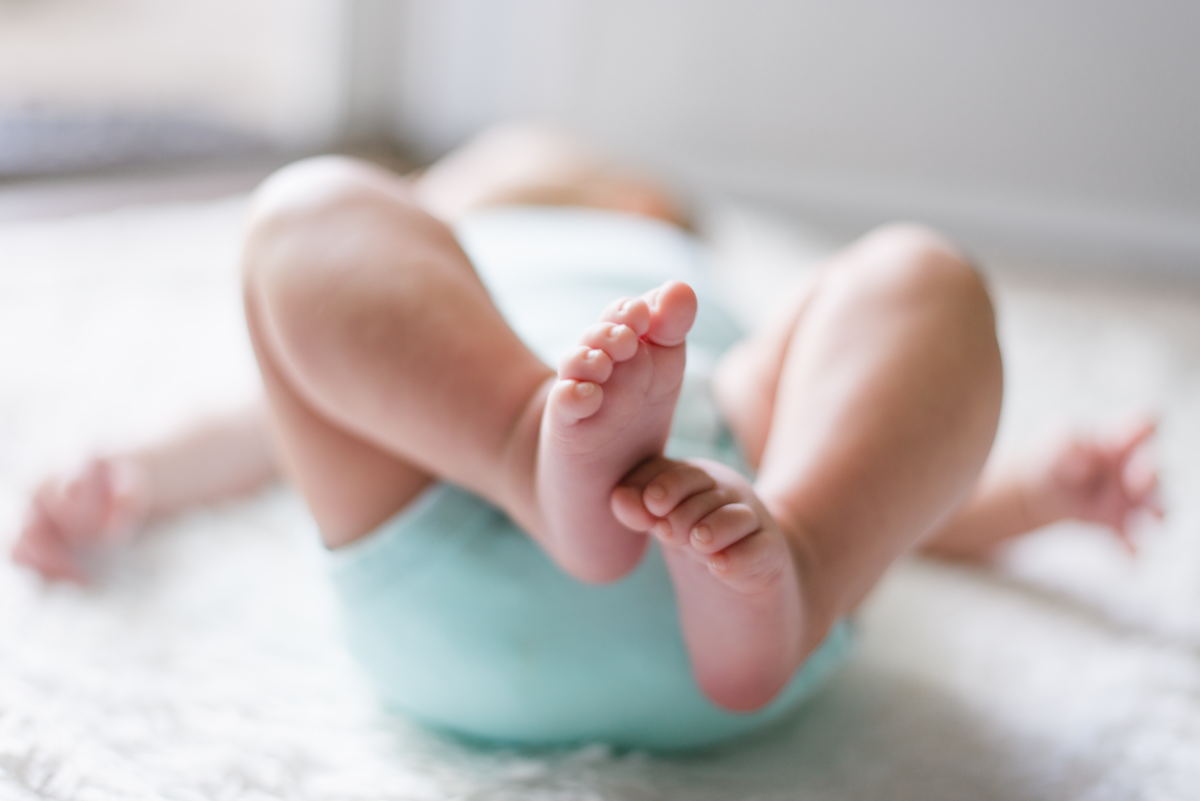 Baby Lying on a Bed