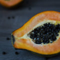 Papaya, cut it in two on a table