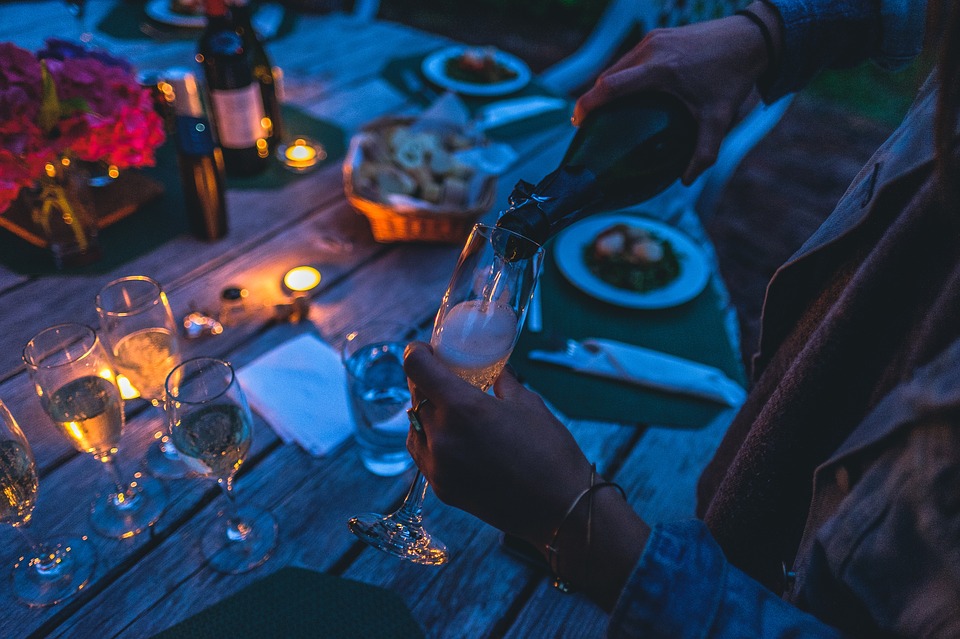 Man pouring champagne into a glass