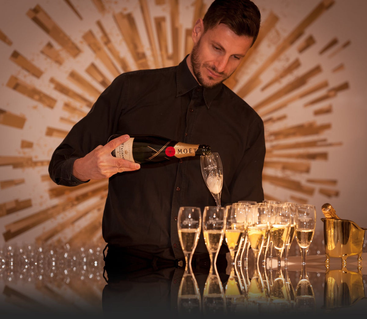 Man Pouring Champagne into Glasses