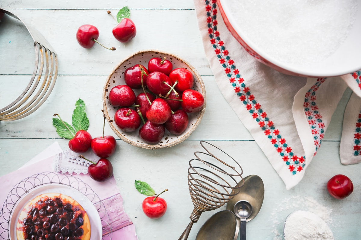 Cherries in a bowl on a table
