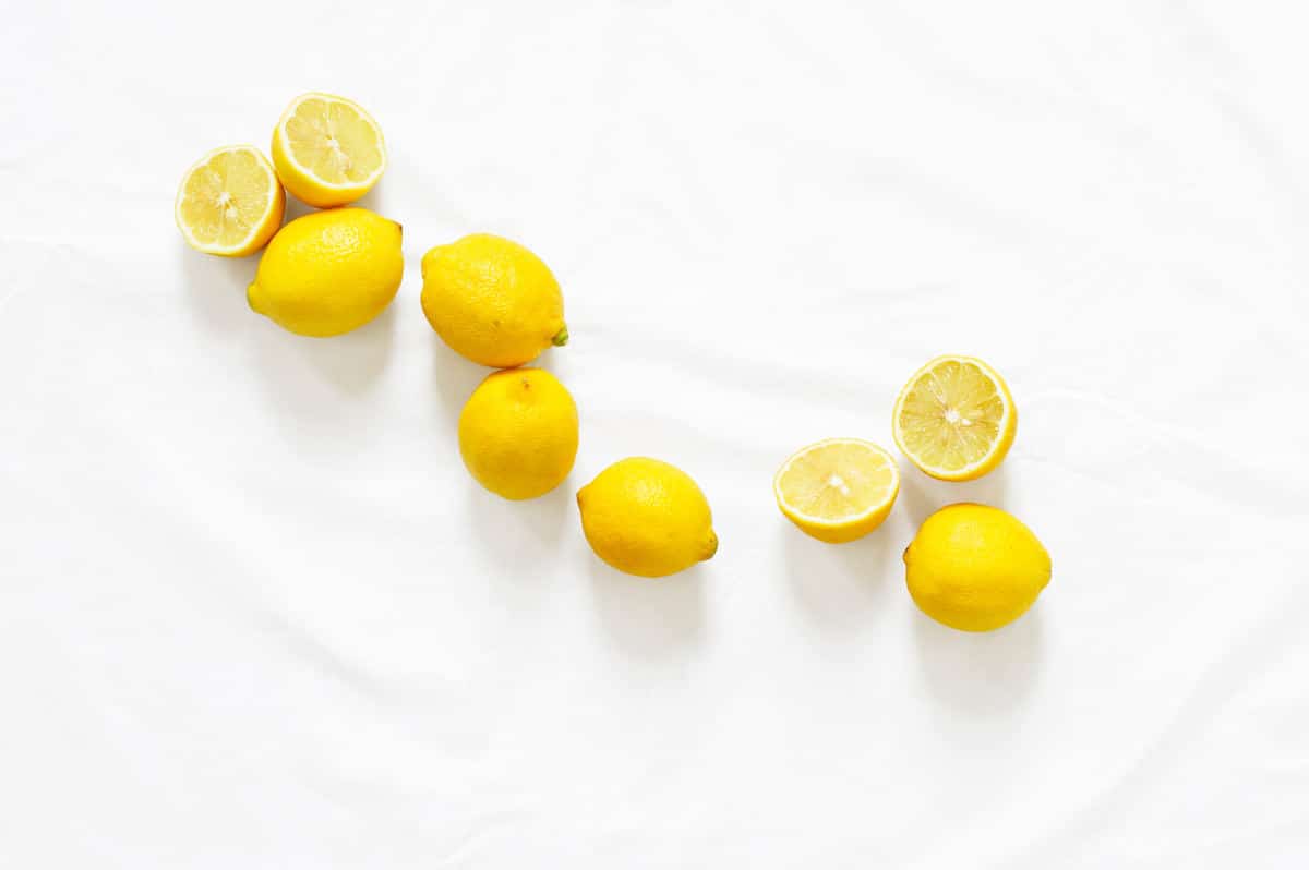 Cut Lemons on a White Tablecloth