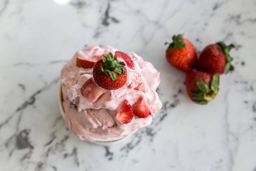 Bowl of Soft Ice Cream with Strawberries on Top