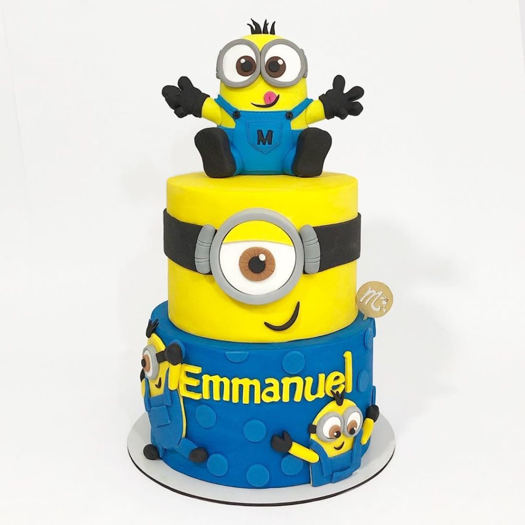 Cake For A Minion Lover Strawberry Cake Covered In Buttercream All The  Minions Are Modelling Chocolate The Big Minion Was Originally G   CakeCentralcom