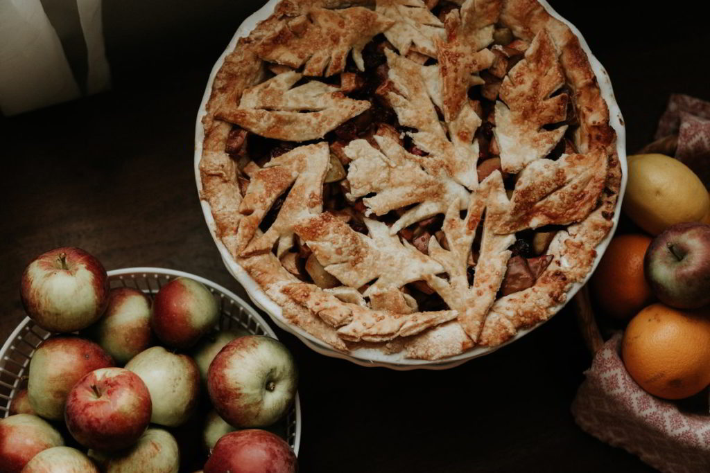 Apple Pie on a Table with apples