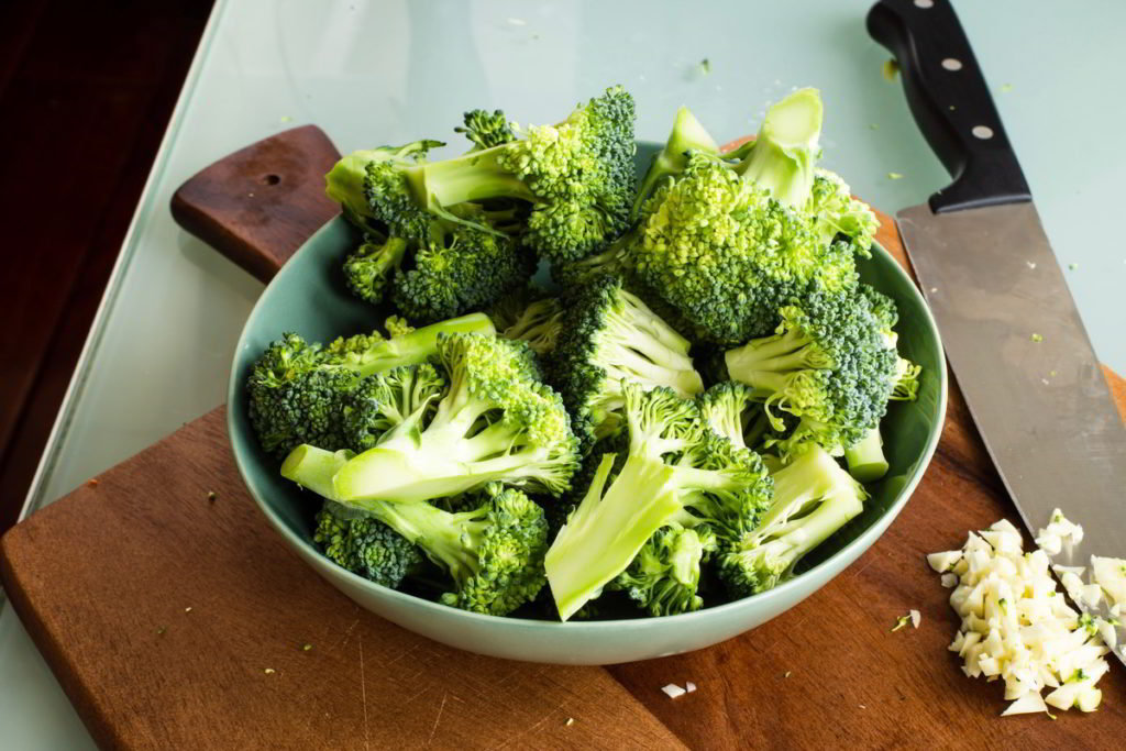 Broccoli florets sliced and in a bowl