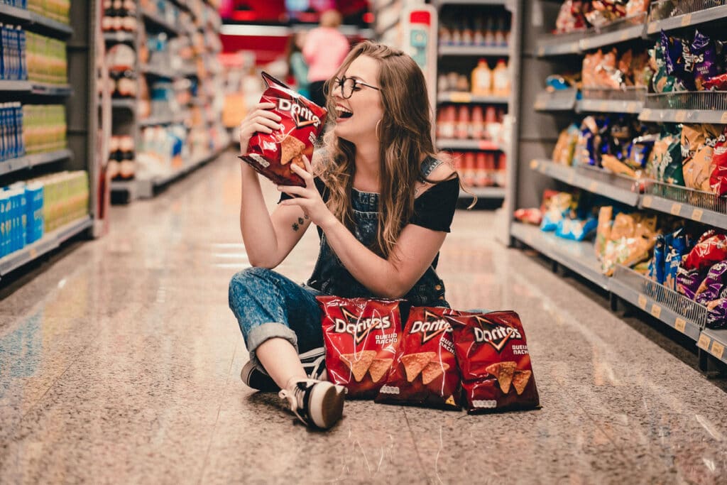 Woman Eating a Bag of Doritos