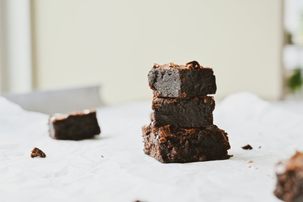 Brownies stacked to illustrate freezer-friendly bar cookies.