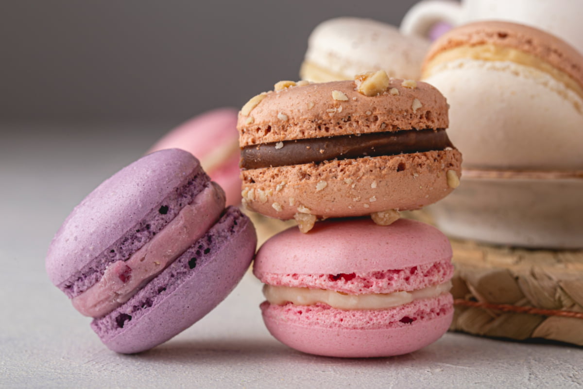 Colorful macaron shells with creamy fillings.