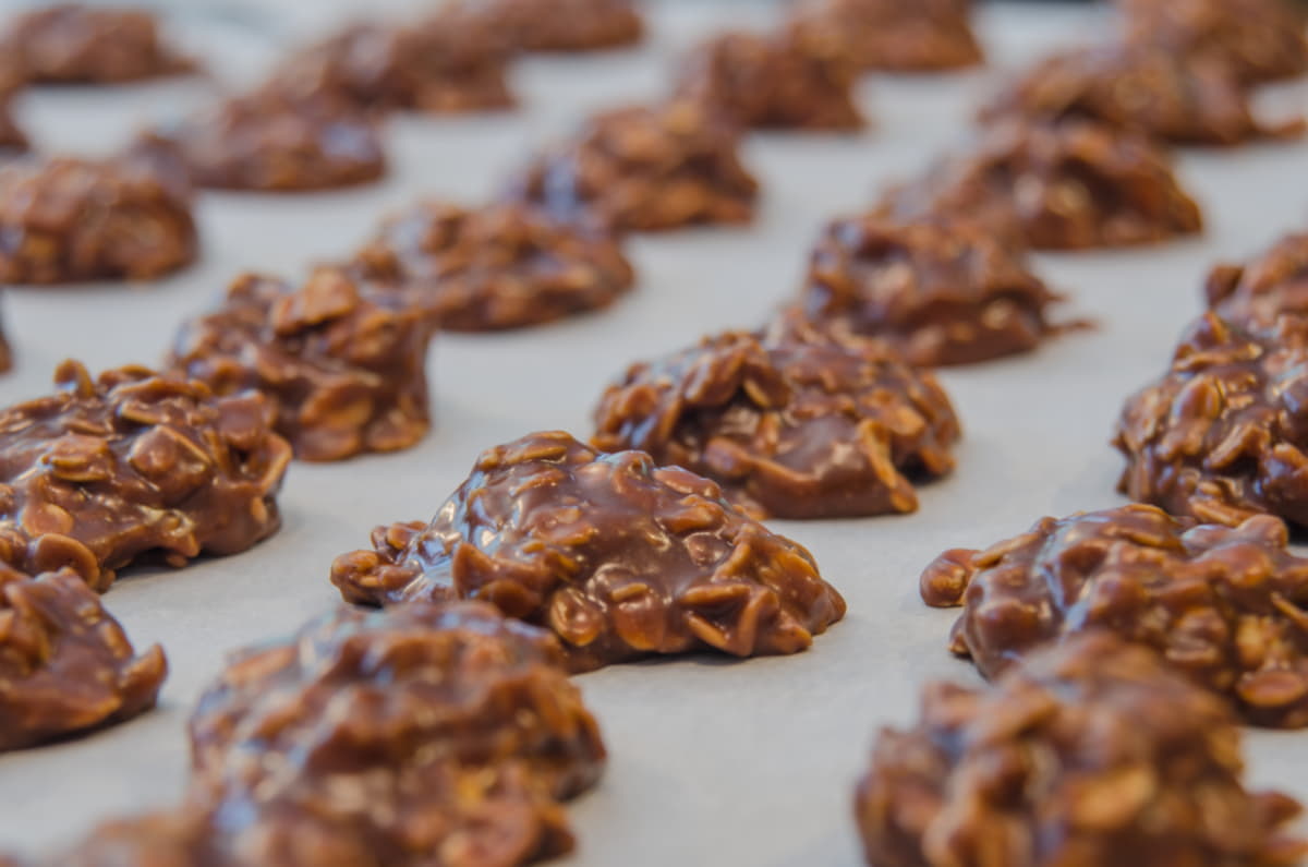 No-bake cookies arranged on parchment paper.