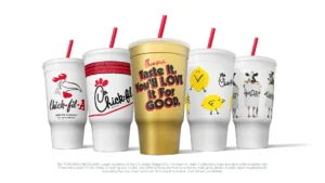 Chick-fil-A 2026 Newstalgia collectible cups with Golden Fan Cup in center