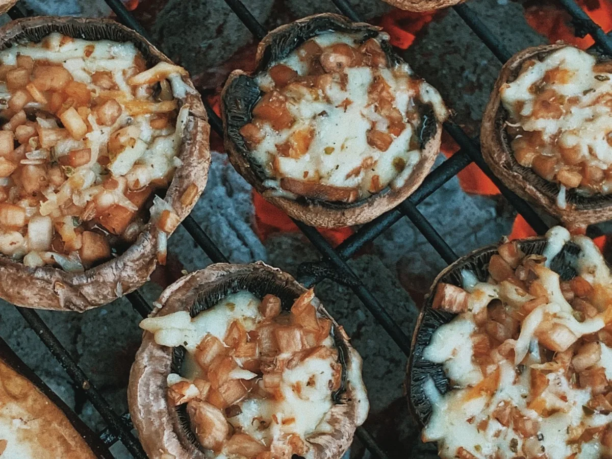 Large portobello mushroom caps filled with tomato sauce, melted cheese and basil
